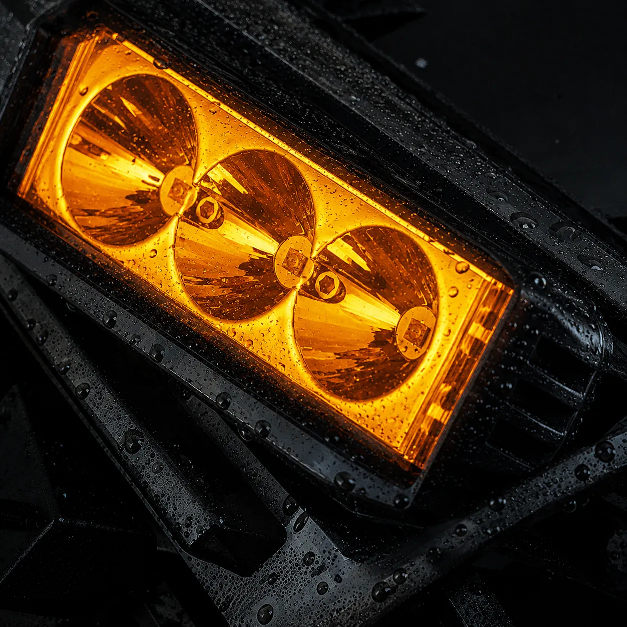 Amber auxiliary light with water droplets on the lens